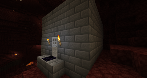 a stone brick cube with a door in the Nether