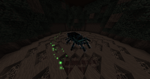 in a dark, cobwebbed room sits an enormous blue tarantula