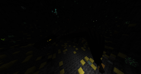 in a dark underground lair can be seen the glowing eye of a massive dragon