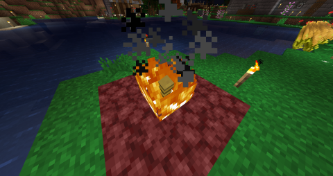 on a platform of netherrack, a bronze egg sits inside a flame