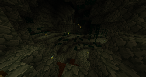 a cavern of gray stone, moss and stalactites, lit with torches