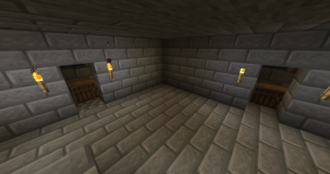 a stone brick room with two small openings, the feet of zombies can be seen through one opening