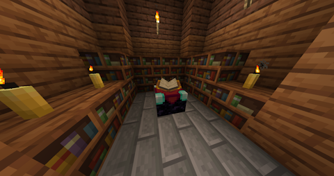 a small room with bookshelves, candles, and an enchanting table in the center