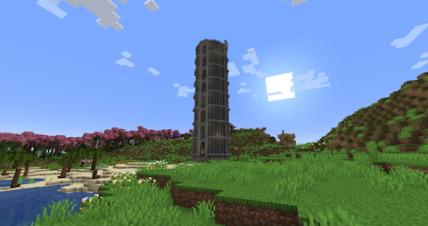 a huge stone tower rises from the plains along with the morning sun